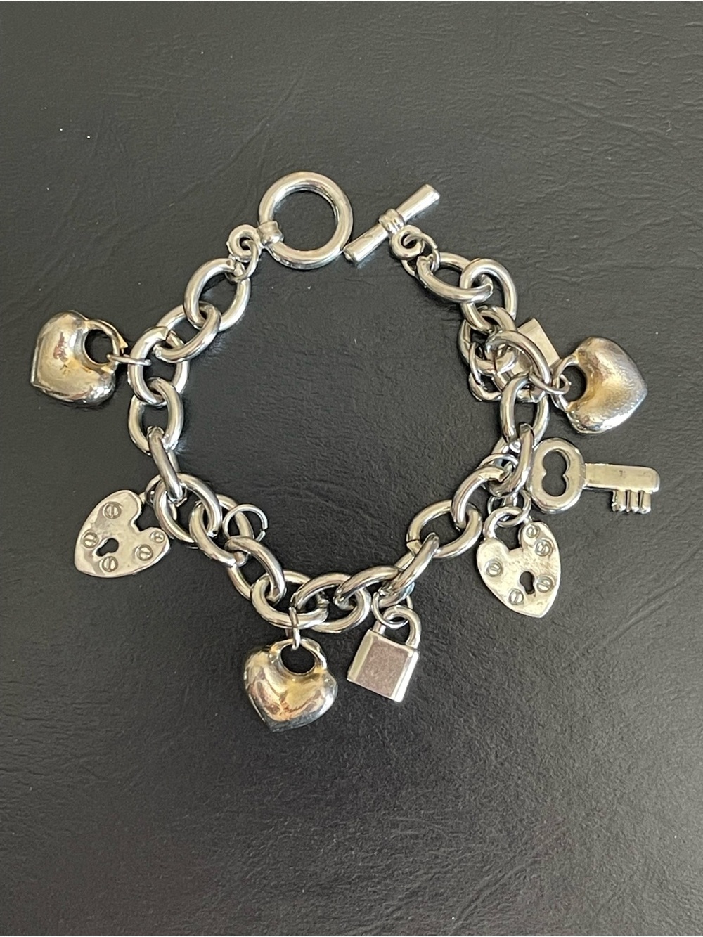 Rhodium plated silver tone Heart & Key Charm Bracelet .